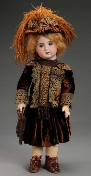 French Bisque Child Doll.: Description French, circa 1899. Bisque socket head incised SFBJ Paris. Jumeau mold with blue set eyes, open mouth with teeth and pierced ears. Original French jointed composition and wood body. Loosel