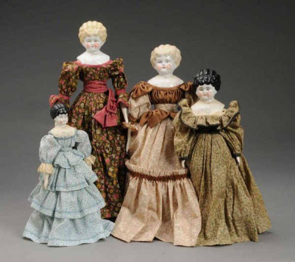Lot of 4: China Pet Name Shoulder Head Dolls.: Description Germany, circa 1905. Bertha has blonde hair, painted blue eyes, rosy cheeks, a new cloth body with leather boots, and is redressed in cotton gown. Agnes has blonde hair, painted blue eyes,