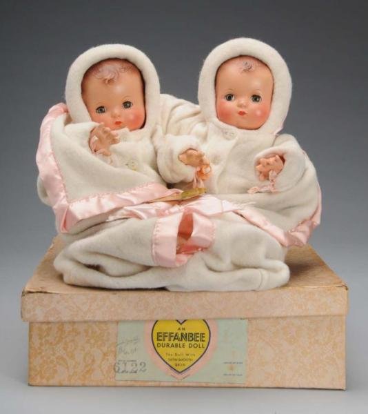 Effanbee Twin Compo/Cloth Baby Dolls Orig Box.: Description American, circa 1947. Babies have composition heads marked Effanbee Patsy Baby, molded brown hair, blue lashed sleeping eyes, cloth bodies, composition hands, wearing original hooded jacke