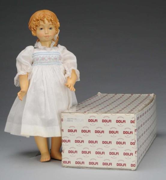 Dolfi Carved Wood Doll Susie.: Description Italian, 1990. #295 of a limited edition of 2000. Beautifully carved from maple wood, lovely hand-painted face and hair with full pony tail and curls framing face. Ball-jointed neck, shoul