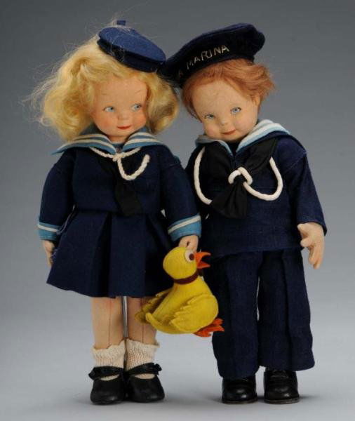 Pair of Felt Lenci Dolls.: Description Italian, circa 1930s. Jointed felt dolls with molded heads, round character faces, blue painted side-glancing eyes, smiling closed mouths, and original inset mohair wigs. Boy's hair is spa
