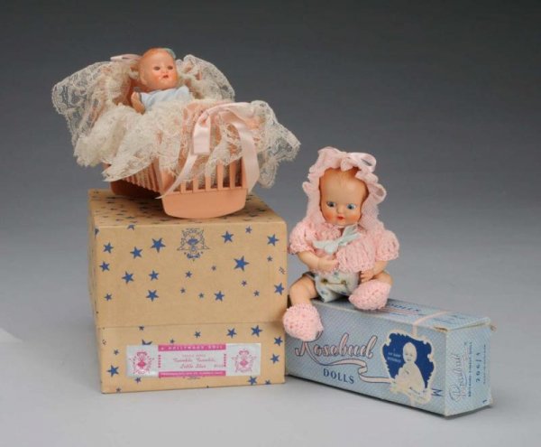 Lot of 2: Boxed Baby Dolls.: Description Circa 1950. One is Baby Rosebud in her original box. All hard plastic and fully dressed with sleeping eyes and molded hair. Other is Hollywood Baby in original box labeled Twinkle, Twinkle