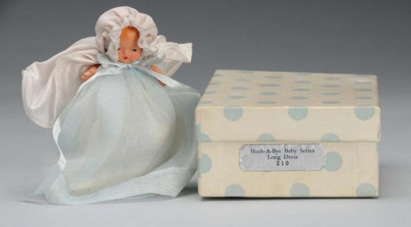 Rare Bisque Nancy Ann Storybook Baby Doll.: Description American, 1940s. #210 Hush-A-Bye Baby Long Dress incised "Story Book Doll". Has molded hair and painted features. Jointed shoulders and hips with star hand. Wearing original baby gown, cap