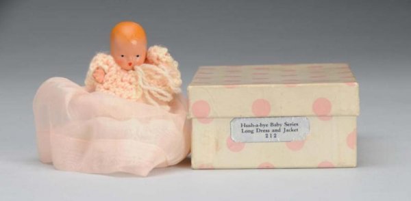 Rare Bisque Nancy Ann Storybook Baby Doll.: Description American, 1940s. #212 Hush-A-Bye Baby Series Long Dress and Jacket , incised "Story Book Doll". Has molded hair and painted features. Jointed shoulders and hips with star hand. Wearing ori