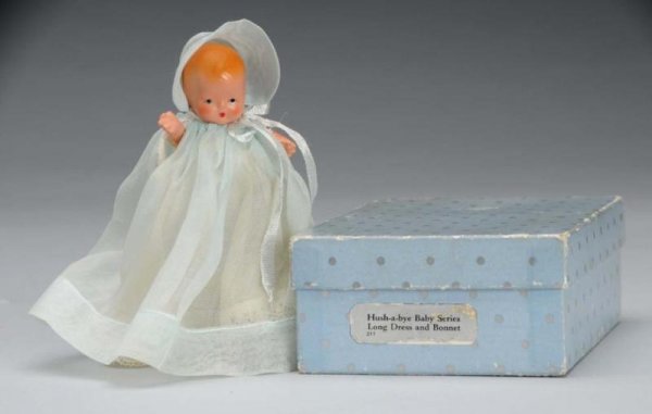 Rare Bisque Nancy Ann Storybook Baby Doll.: Description American, 1940s. #211 Hush-a-Bye Baby Series Long Dress and Bonnet, incised "Story Book Doll". Has molded hair, painted features, jointed shoulders and hips, and star hand. Wearing origina