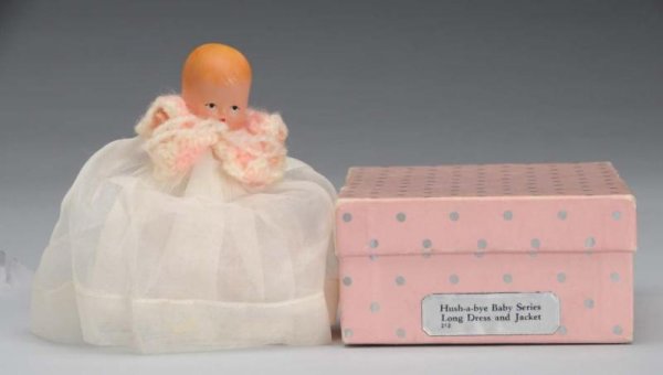 Rare Bisque Nancy Ann Storybook Baby Doll.: Description American, 1940s. #212 Hush-A-Bye Baby Series Long Dress and Jacket , incised "Story Book Doll". Has molded hair, painted features, jointed shoulders and hips, and star hand. Wearing origin