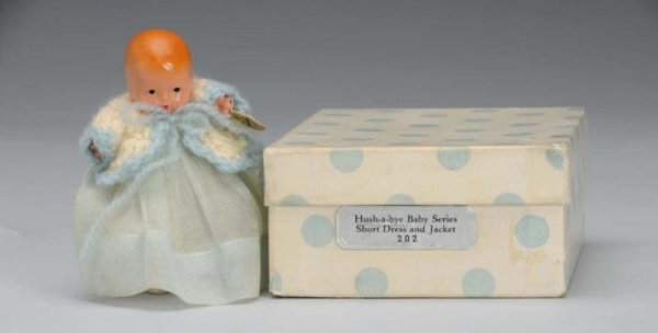 Rare Bisque Nancy Ann Storybook Baby Doll.: Description American, 1940s. #202 Hush-A-Bye Baby Series Short Dress and Jacket , incised "Story Book Doll". Has molded hair, painted features, jointed shoulders and hips, and star hand. Wearing origi