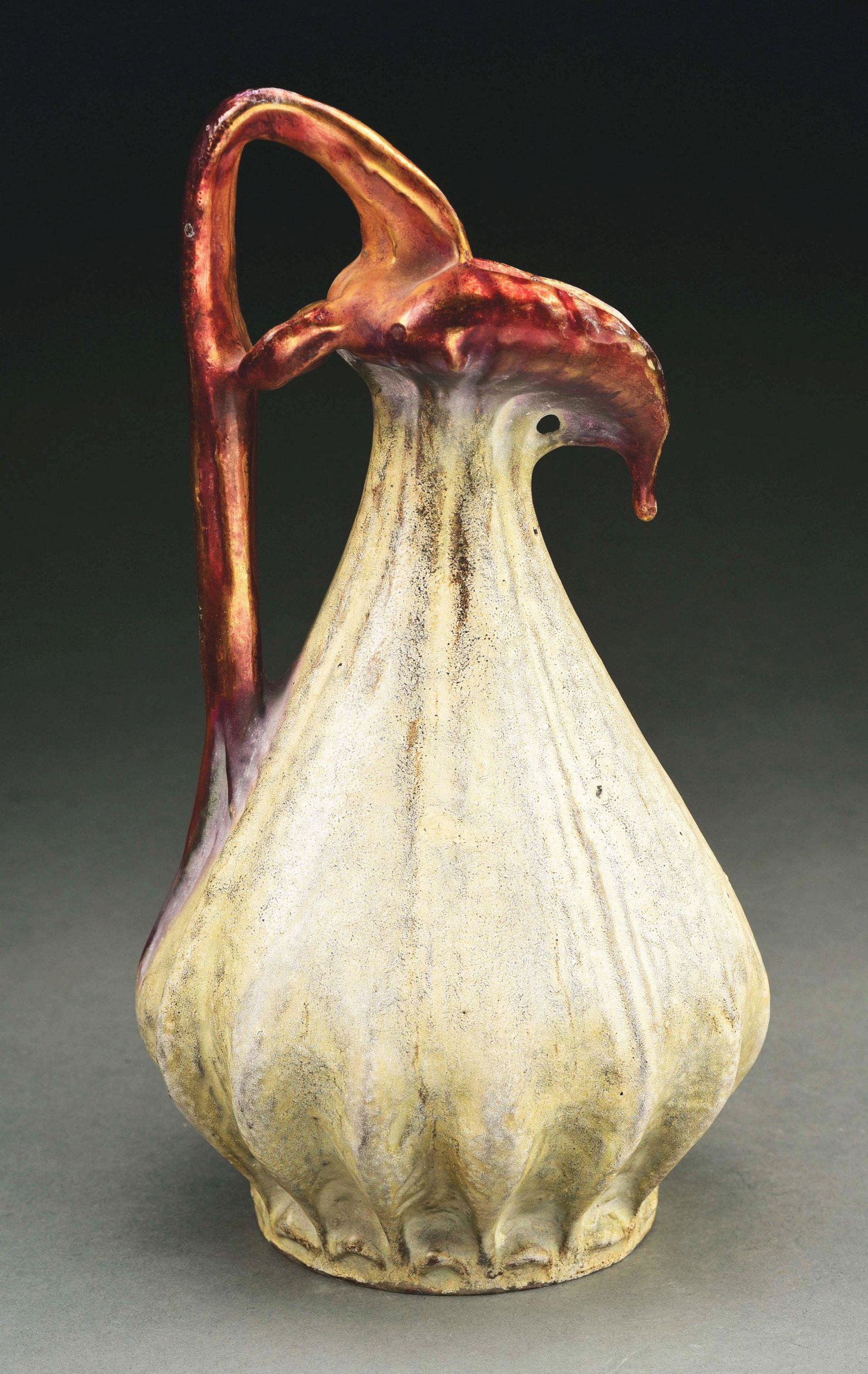AMPHORA EDDA PITCHER.: Experimental glazing. Raised Edda mark, Oval Amphora mark, Amphora Turn mark. 11 - 3/4" high. Similar examples are illustrated in Monsters and Maidens: Collectors Edition, Vreeland, pp. 214-215. Condi