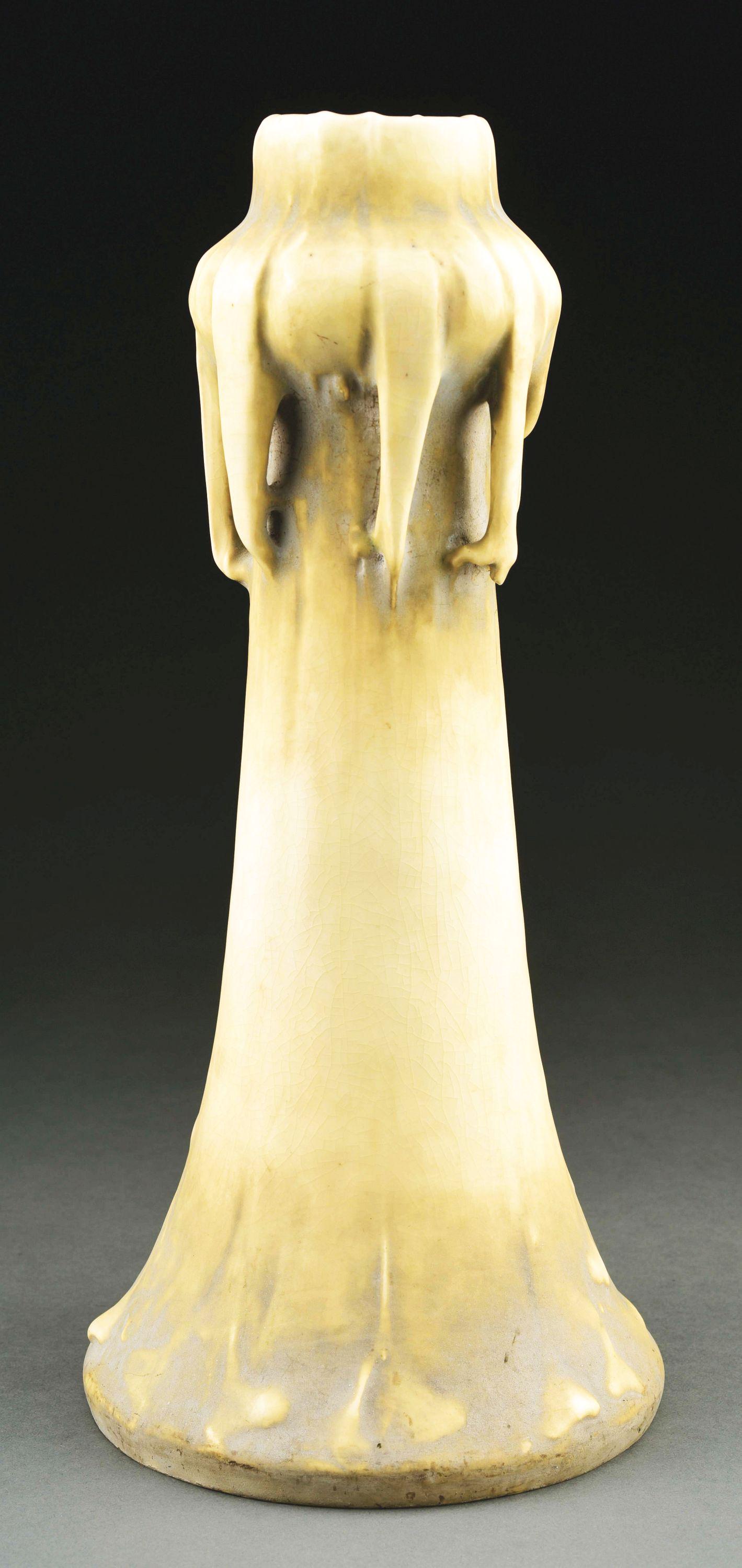 TALL AMPHORA EDDA VASE DESIGNED BY EDUARD STELLMACHER.: Cream glazes. Eduard Stellmacher monogram on body of vase, raised Edda mark, impressed "3615" with impressed heart, painted "901-244Sa", Amphora Oval. 16 - 3/4" high. Illustrated in Monsters and Maide
