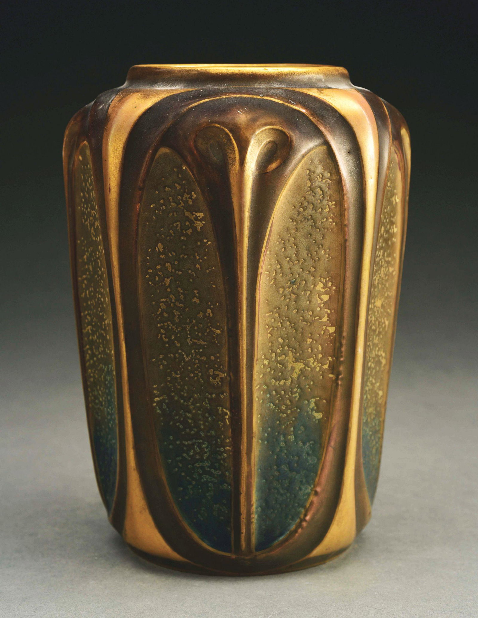 AMPHORA STYLIZED FLORAL VASE.: Dark brown glazes with applied gold gilt. Crown mark, Austria Oval mark, Amphora Oval mark, impressed "8910-53". 8 - 3/4" high. A similar example is illustrated in The House of Amphora, Scott, p. 139.