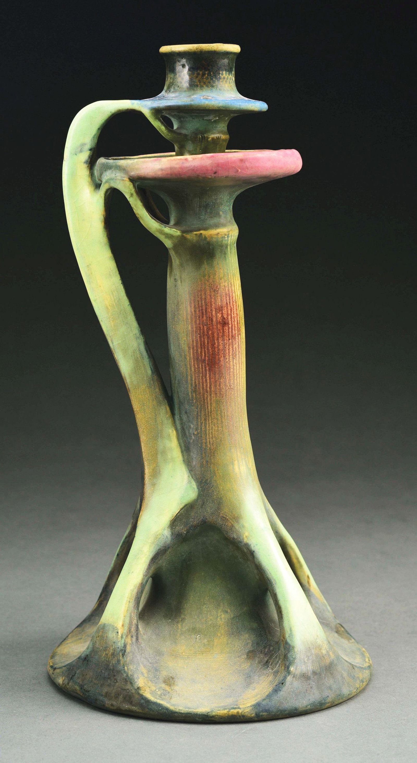 TALL AMPHORA CANDLESTICK.: Blue, green and red glazes. RSTK mark, Amphora Oval, impressed "3544". Illustrated in Monsters and Maidens: Collectors Edition, Vreeland, p. 217. Condition: (Mint). Dimensions: 13 - 3/4" T x 7" D.