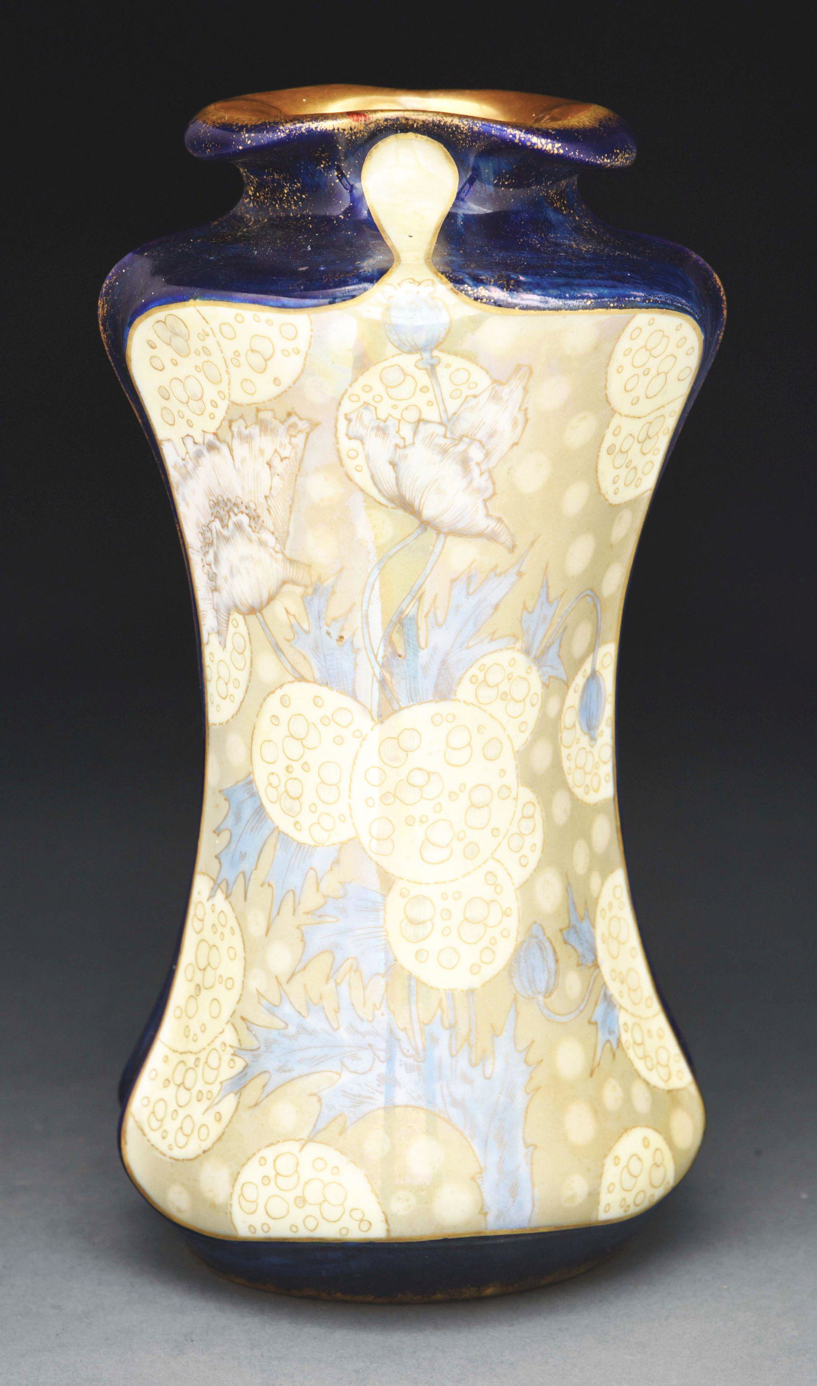 AMPHORA POPPY VASE.: Cobalt blue body with painted and glazed poppy flowers. Amphora oval and Osiris marks. c. 1902. Condition: (Mint). Dimensions: 11 - 1/2" x 6 - 1/2" x 6".