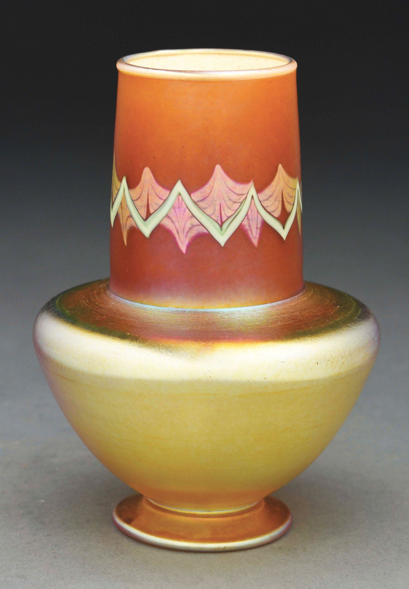 TIFFANY STUDIOS TEL EL AMARNA VASE.: A classic Tiffany Studios Tel El Amarna vase with a gold iridescent body and bronze neck with green and silver iridescent overlapping pattern. The 5 - 3/4” tall vase is in excellent condition, with 
