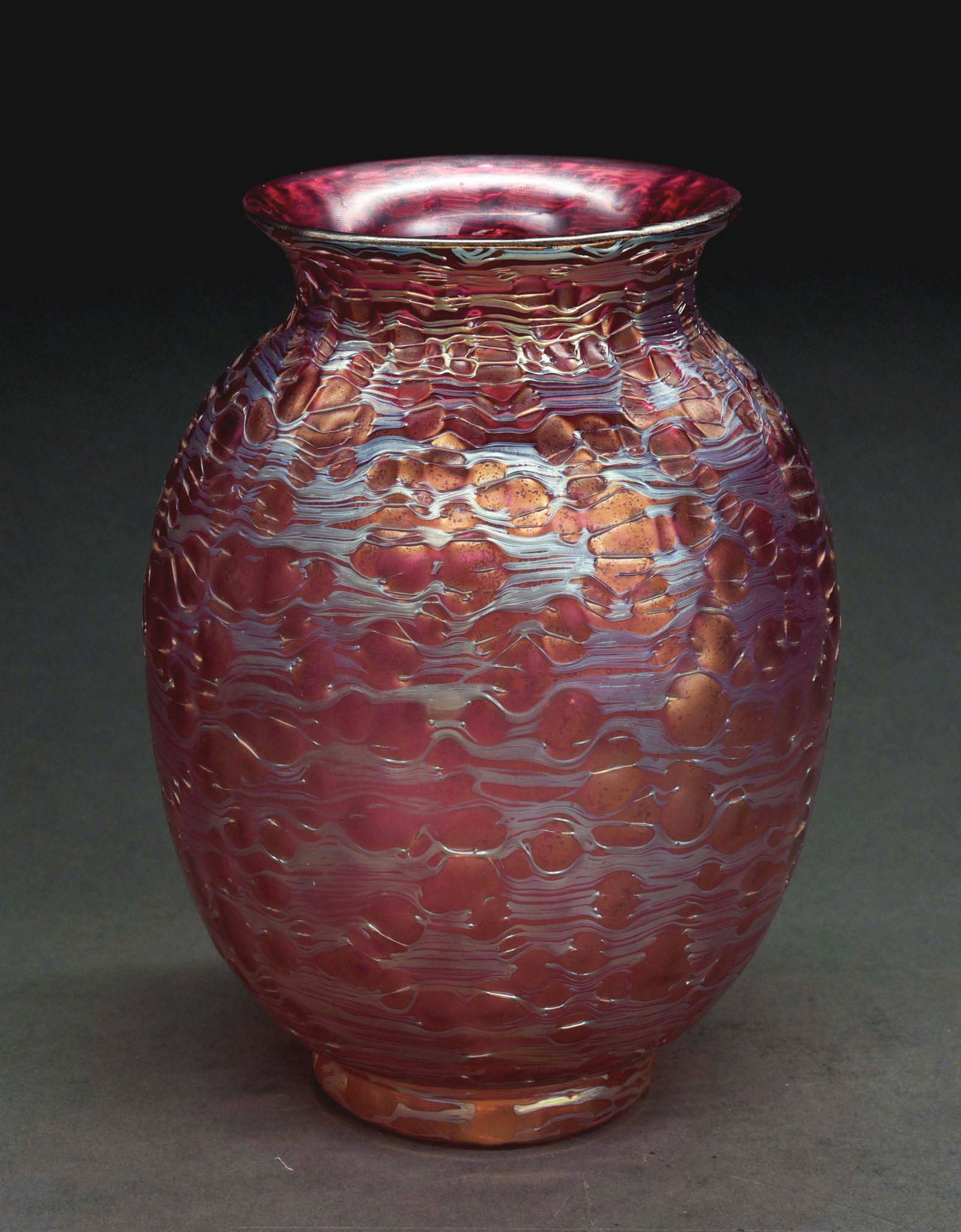 PINK LOETZ VASE.: A beautiful medium sized pink vase by Loetz. New Orbulin décor. The ovoid vase has translucent pink art glass, with thin strands of light blue iridescence laid over top, creating a crater-like patter