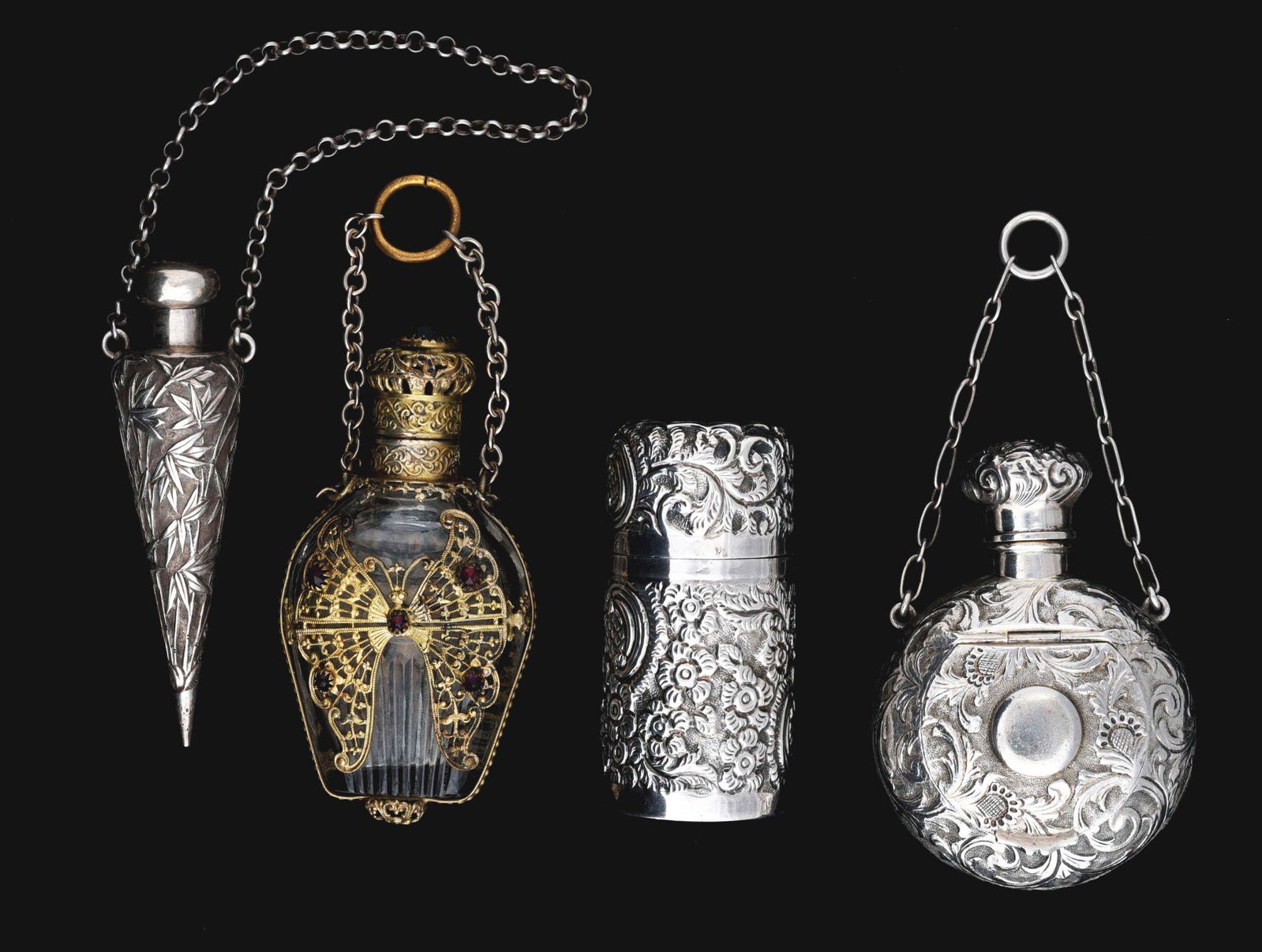 LOT OF 4: ANTIQUE PERFUME BOTTLES.: Lot consists of four antique perfume bottles. First is a c. 1869 sterling silver compact with mirror and scent bottle, embossed with floral work, with hallmarks and small chain, no glass stopper. 2 - 