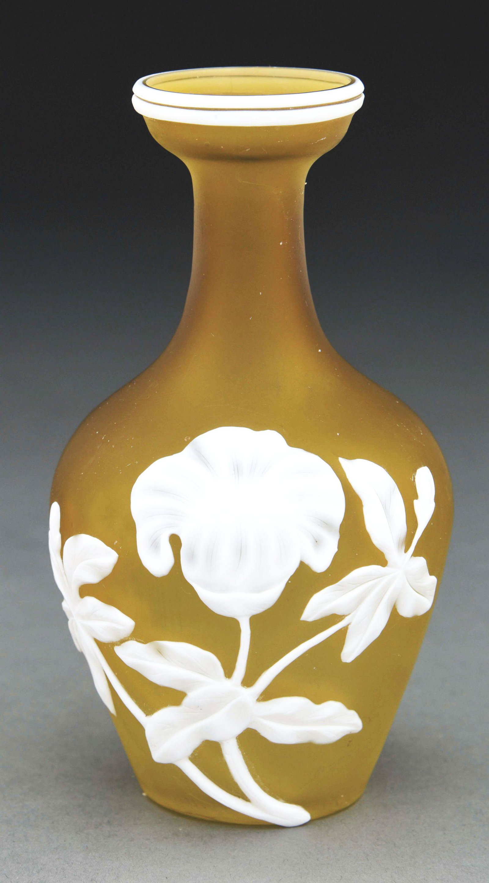 WEBB SMALL FLORAL VASE.: A lovely small vase by Thomas Webb and Sons. The vase features white cameo flowers set against a frosted dark citron ground. The vase stands 5 - 1/2” tall and is in excellent condition, free of any 