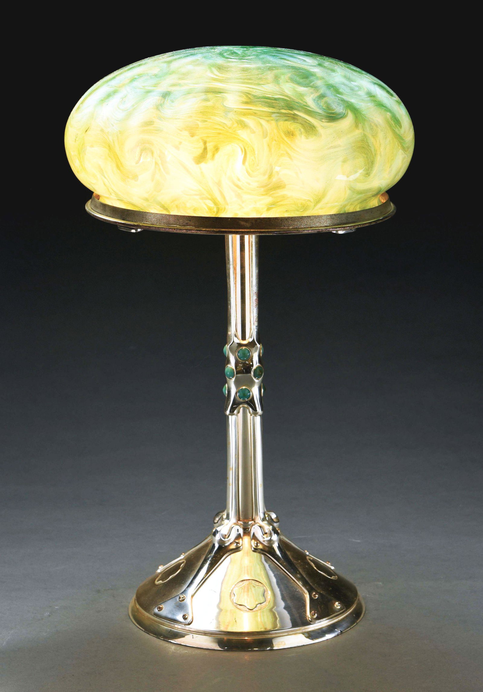 LOETZ TABLE LAMP.: An Austrian Art Nouveau silvered bronze and glass Loetz table lamp decorated with an aqua blue to green impressionistic Titania pattern glass shade by Loetz, atop a silvered bronze decorated secession