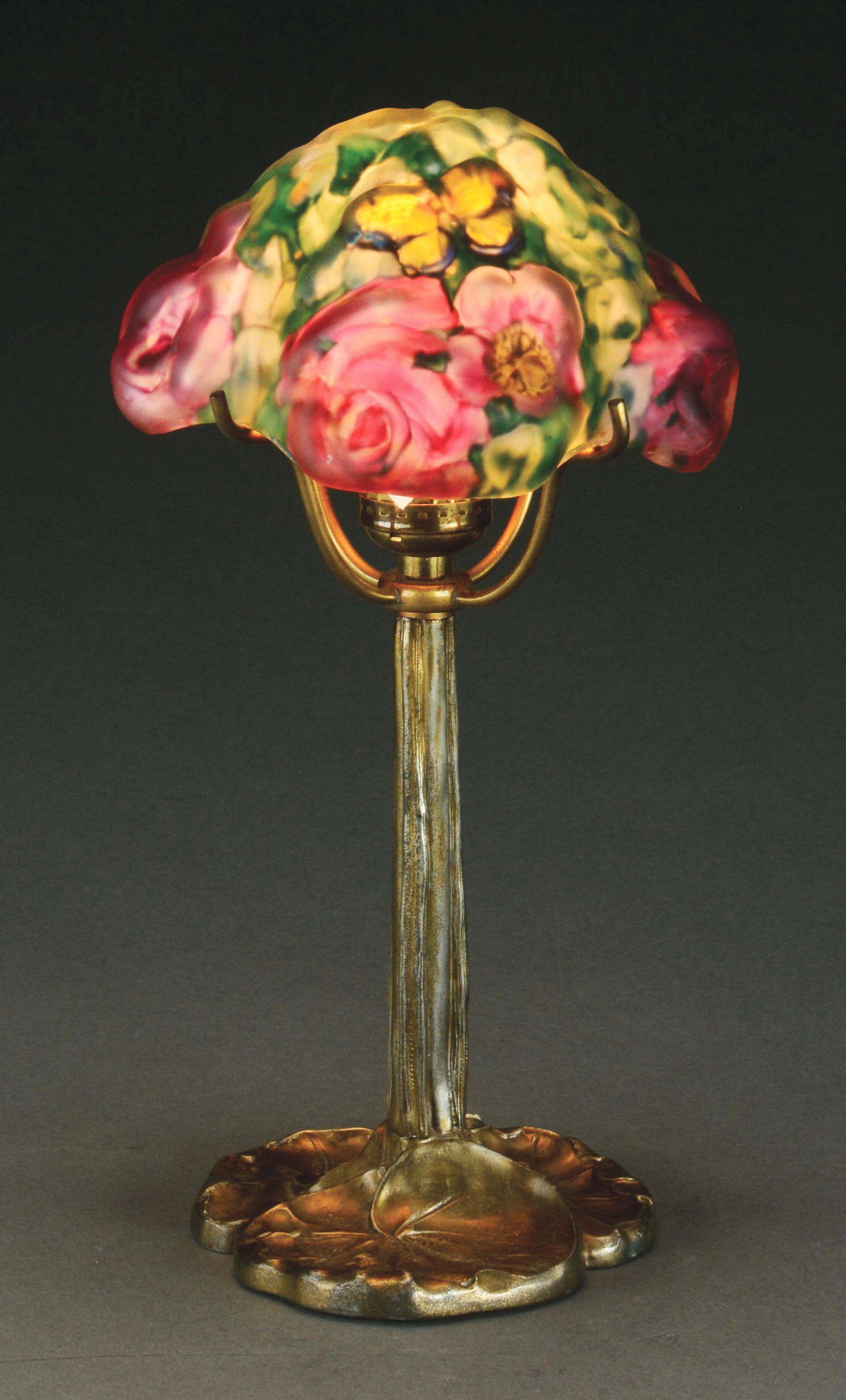 PAIPOINT MINIATURE PUFFY LAMP.: A beautiful miniature puffy lamp by Pairpoint. The shade features red-pink roses at each of the four corners, surrounded by green foliage. A golden butterfly with blue outlining the wings, flutters ov