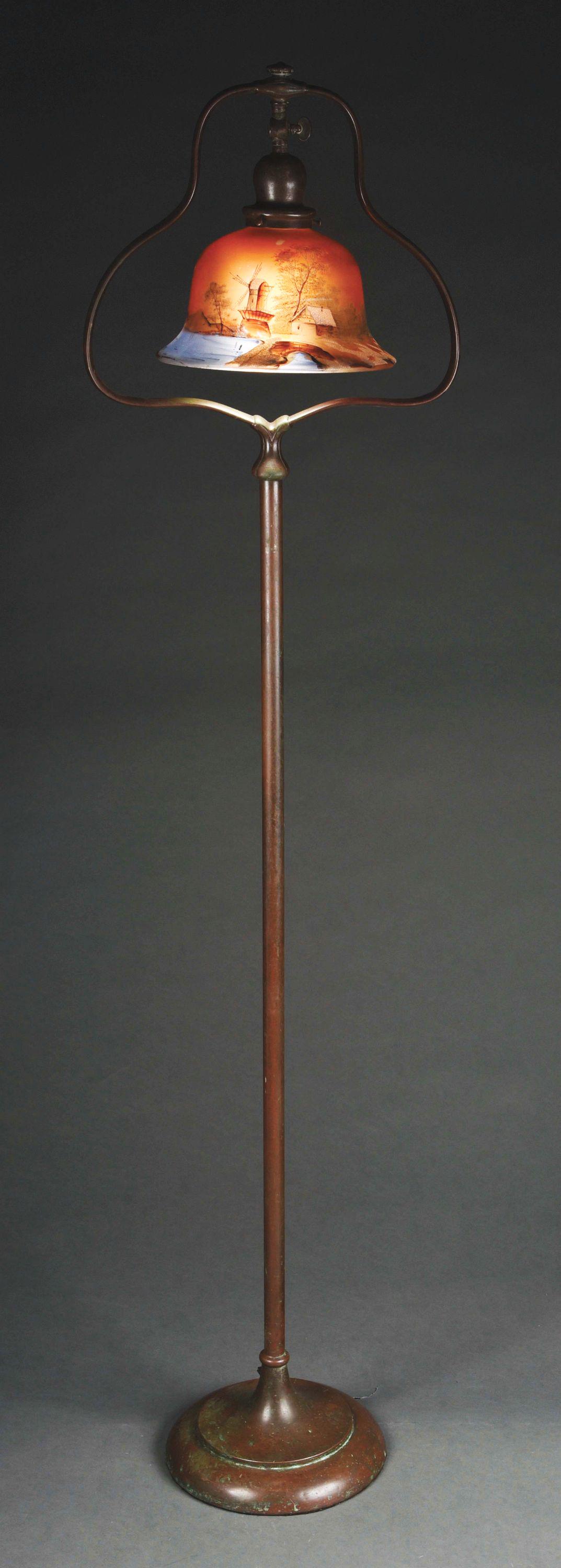 HANDEL FLOOR LAMP WITH PITTSBURGH PAINTED GLASS SHADE.: A Handel patinated floor base with Pittsburgh Painted Glass shade. The shade is obverse painted, depicting a winter scene with a windmill and farm, snow covered trees and a snowy field, with a lake in