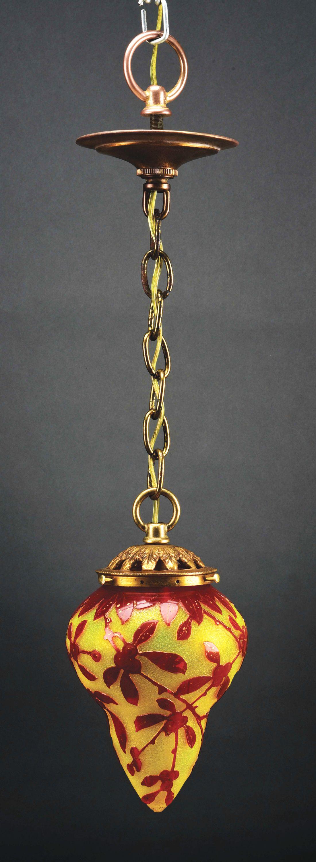 PENDANT CEILING FIXTURE WITH DAUM NANCY CAMEO SHADE.: A small pendant ceiling fixture with Daum Cameo art glass shade. The pear-shaped shade has a pattern of amber leaves and berries with gold flecks, set against a yellow background with chipped ice text