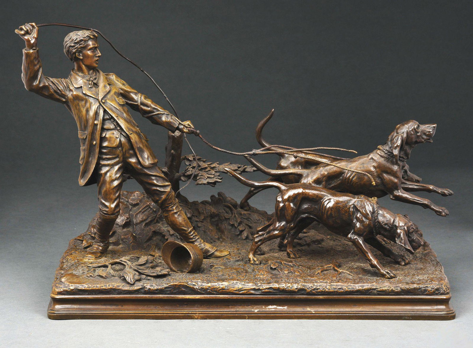 ALFRED DUBUCAND (1828 - 1894) BRONZE.: Alfred Dubucand 19th century bronze of a male valet with three dogs in dark brown patina. 14 - 1/2" tall, 23" wide and 10 - 1/2" deep. This is not a standard shippable item and will require 3rd party