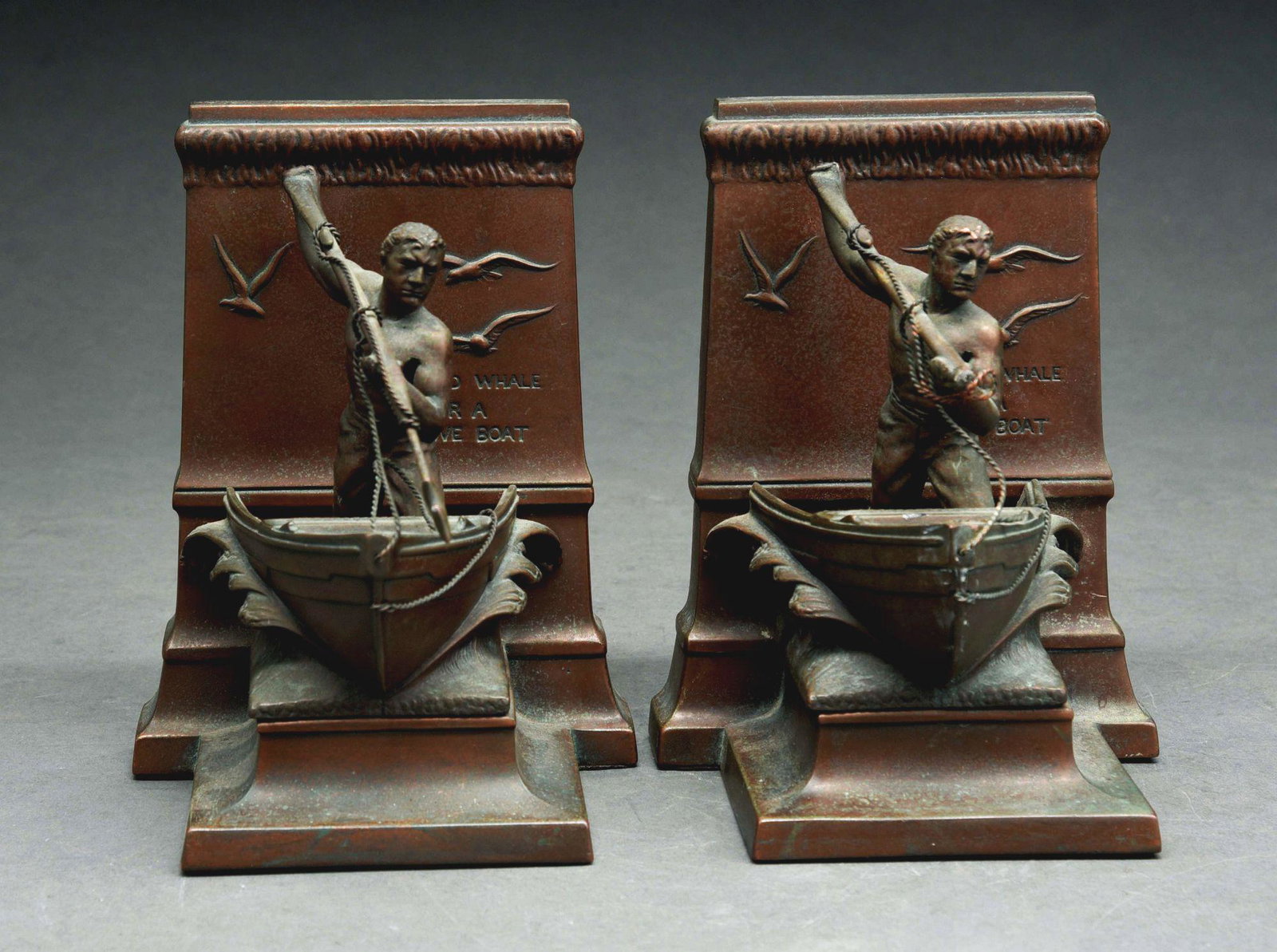 PAIR OF BRONZE BOOKENDS.: Beautiful pair of hand-forged bookends with whaling men on boat. Nice detail. Signature stamp "JB 3132" on back. Condition: (Excellent). Dimensions: Each: 7" x 5 - 1/4" x 5 - 1/2".