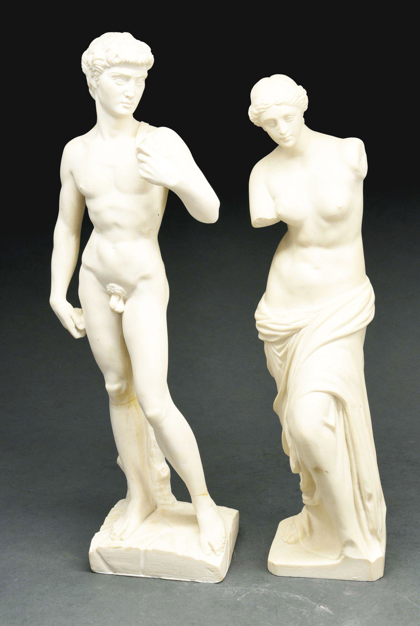 LOT OF 2: MARBLE STATUES.: Lot of two marble statues, the first being of a nude man, 18" tall with a crack below the right knee and left ankle, and the second of a nude lady, 16" tall and with no damage. Condition: (Very Good -