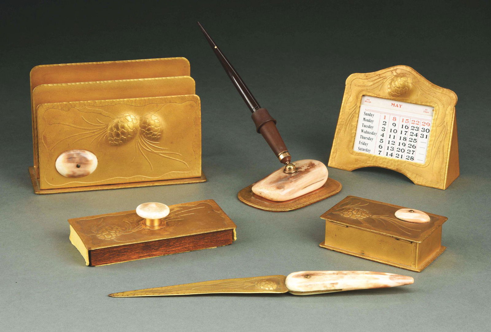 ALBERT BERRY ARTS & CRAFTS HAMMERED COPPER SIX-PIECE: Wonderful original Albert Berry arts and crafts hammered copper six-piece desk set with acid etched pinecone decoration and fossilized bone. Set consists of a letter rack measuring 7" x 3" x 4 - 3/4"