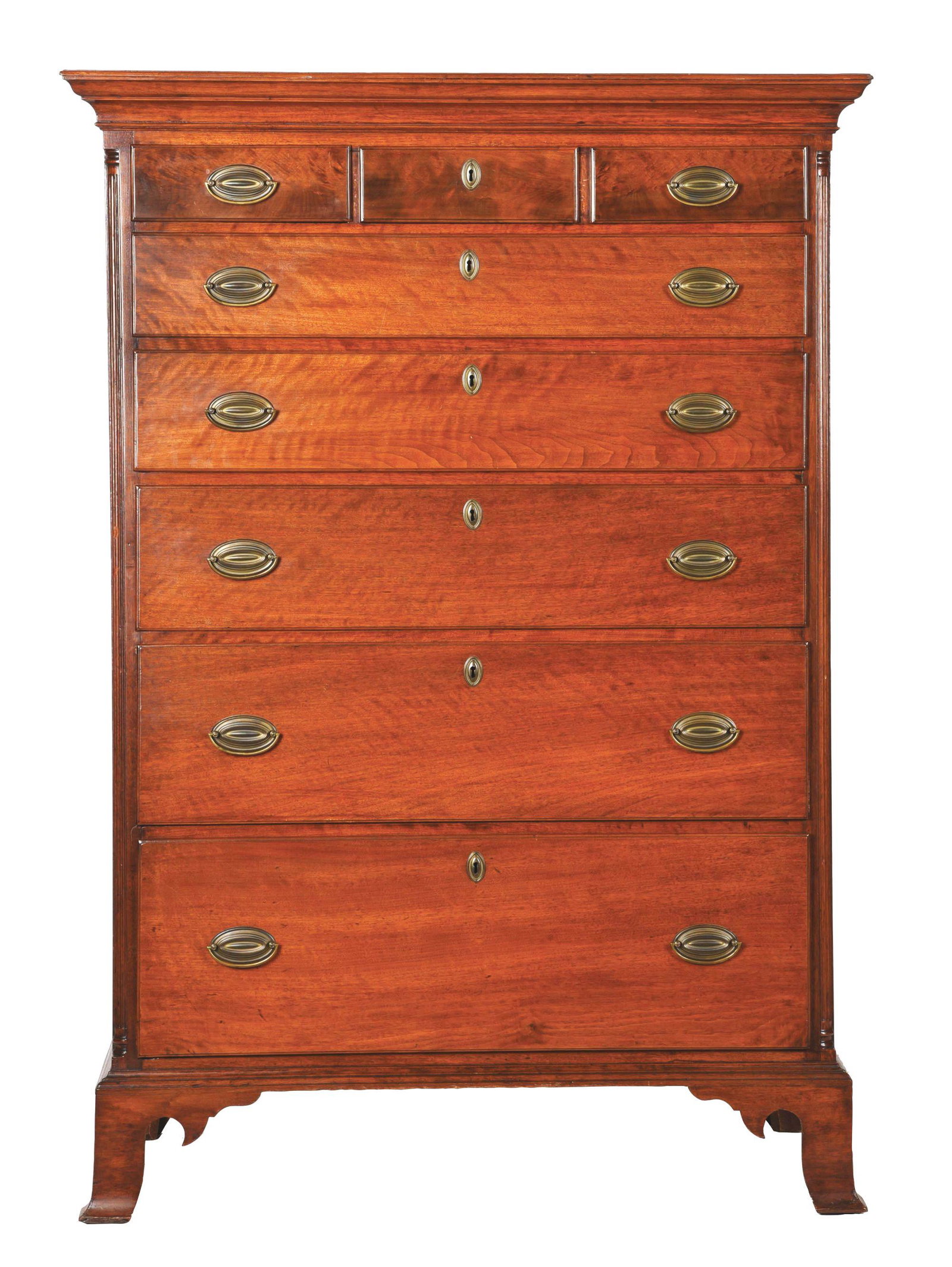 WALNUT TALL CHEST OF DRAWERS.: Walnut and pine, c. 1800. Nicely shaped cornice with three drawers over five drawers, fluted quarter columns and applied flared bracket feet. Brasses replaced, several glue blocks replaced. 65" high, 