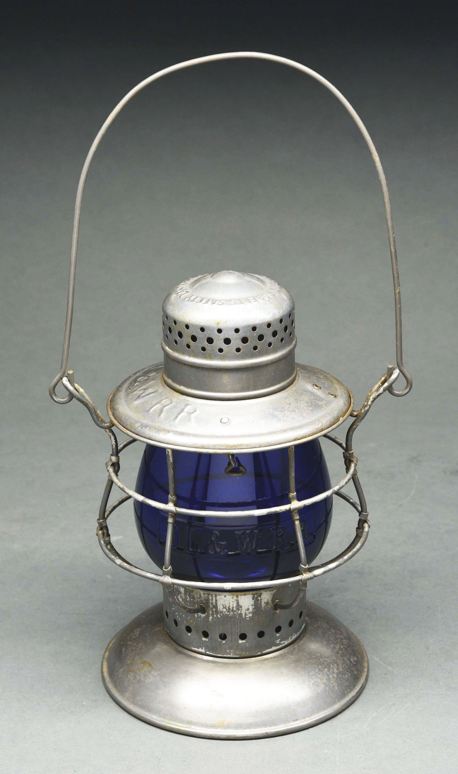 D L & W R R ROBERTS SAFETY BELLBOTTOM RAILROAD LANTERN.: A real nice example of a Roberts Safety Lantern made by the Star Headlight & Lantern Co. for the Lackawanna RR. The lantern is in nice, smooth condition with some minor cleaning apparent. The fount is