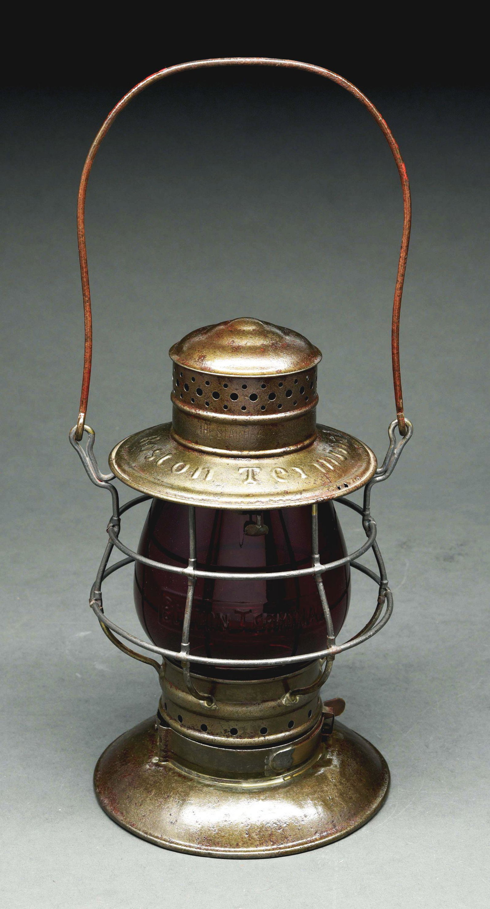 BOSTON TERMINAL STAR HEADLIGHT & LANTERN CO. BELLBOTTOM: An early double guard Star model, c. early 1890's and nicely marked "BOSTON TERMINAL". The bayonet fount fits snugly and has a fixed glass fount with No. 1 functioning ratchet burner. The flashed-red 