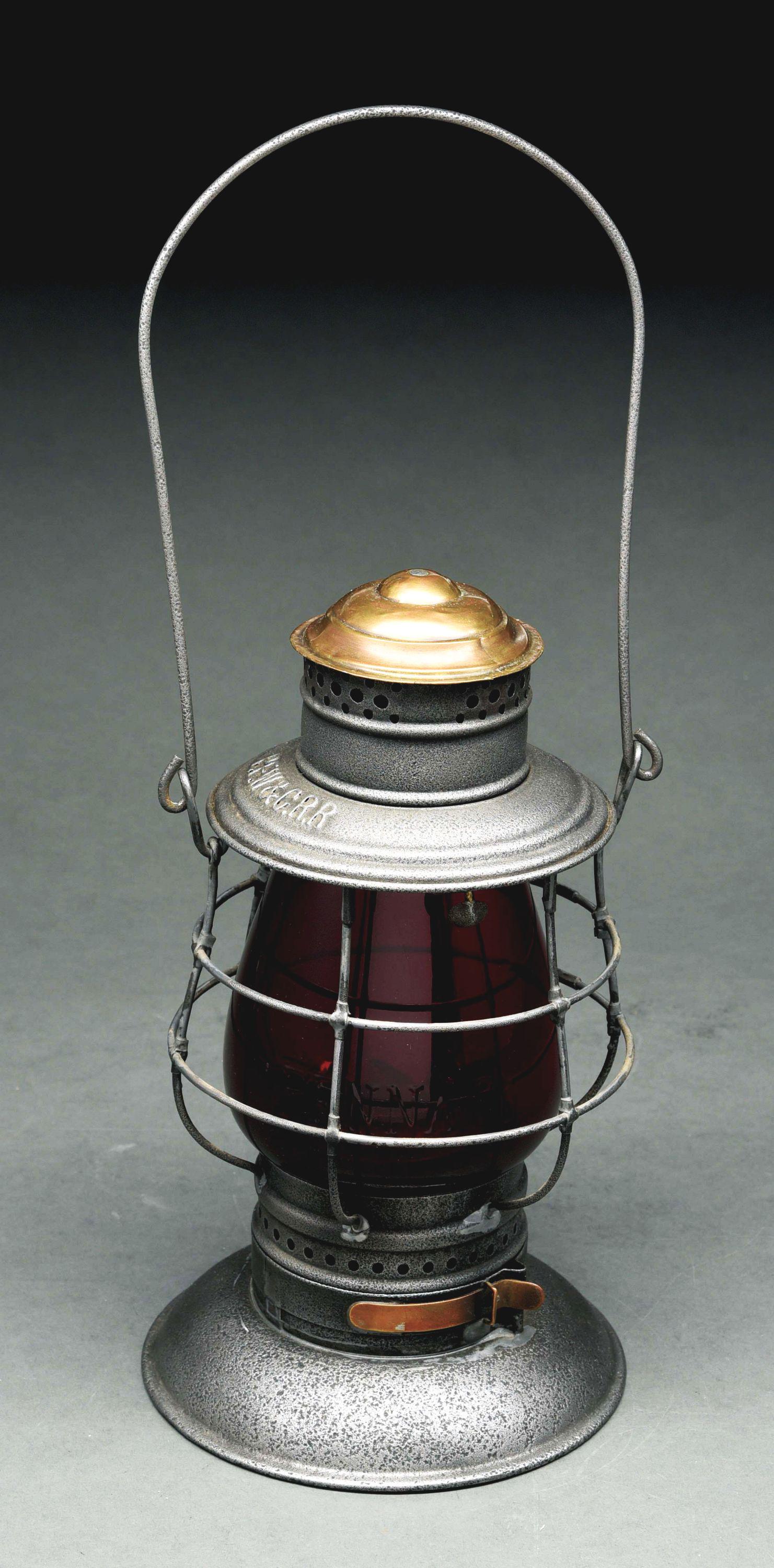 P. F. W & C. R. R ADAMS & WESTLAKE BRASS TOP BELLBOTTOM: A & W double guard 1882 model; 6" frame made for the Fort Wayne Line. The lantern has the correct base with a faint A & W patent stamp. Last date is 1882. Nicely marked "P. F. W & C. R. R." on the lid