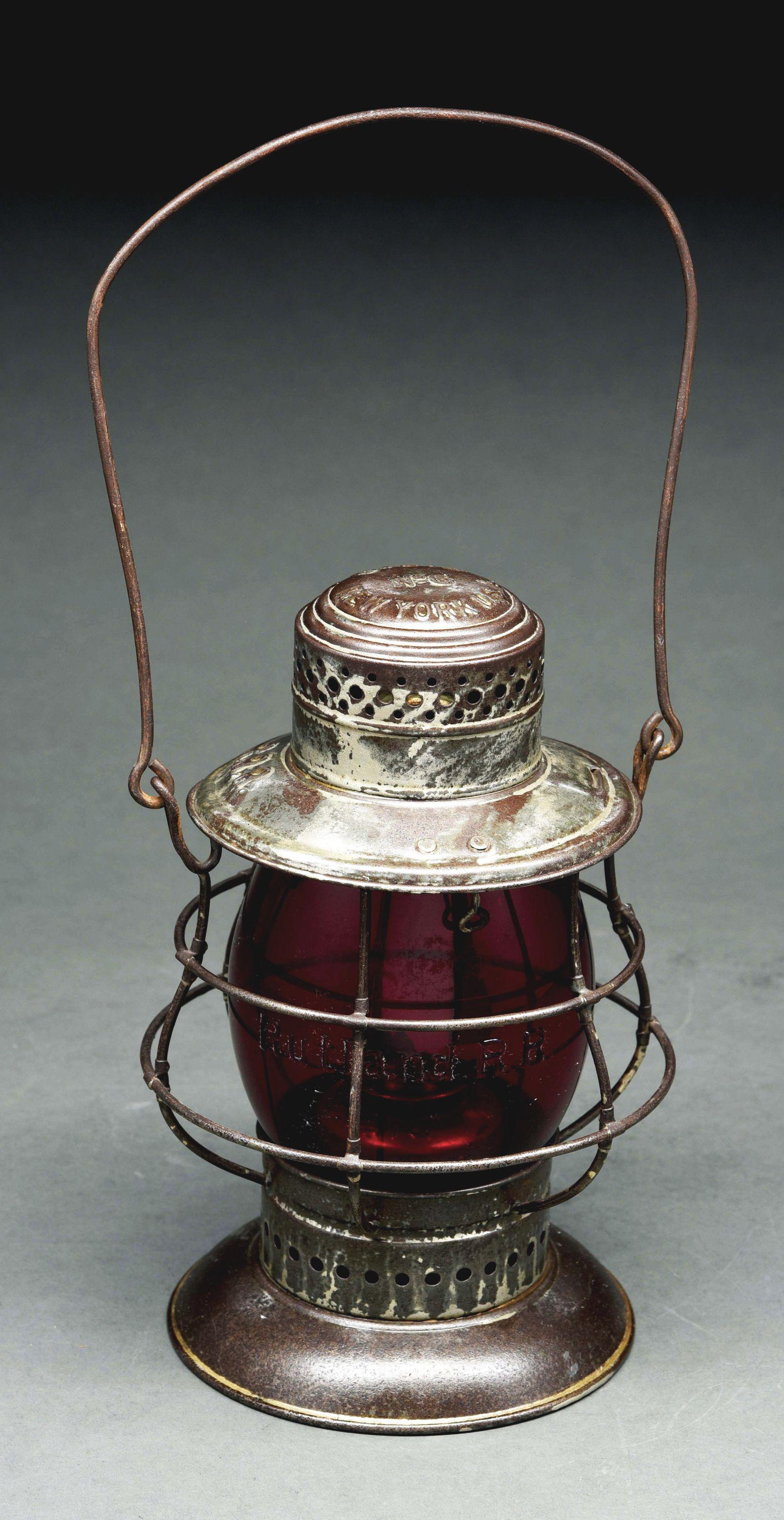 RUTLAND (RRR) DIETZ NO. 6 RAILROAD LANTERN.: RRR embossed on a Dietz No. 6 model in nice condition. Lantern has a nice aged patina and no notable condition issues. Serial No. 2120 is stamped into the reflector. The 6" red Corning NonEx globe is 