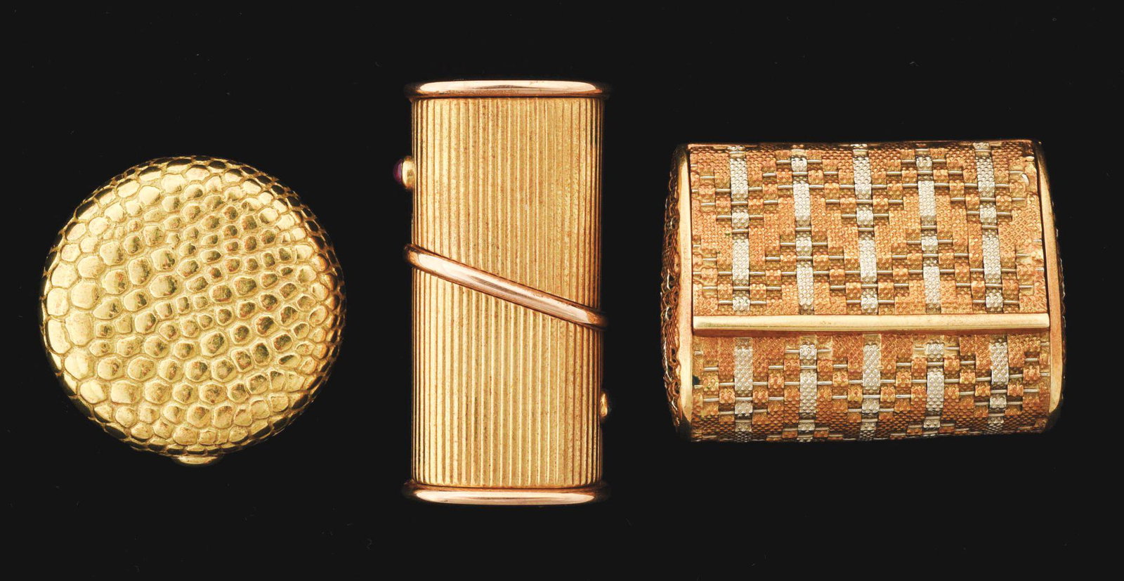 LOT OF 3: GOLD PIECES.: Lot of three gold pieces includes a 18K yellow gold pill box, 1 - 1/2"; second, another 18K yellow gold pill box; and third, an 18K white and yellow gold purse-shaped box. Total weight 47.3 dwt. Condi