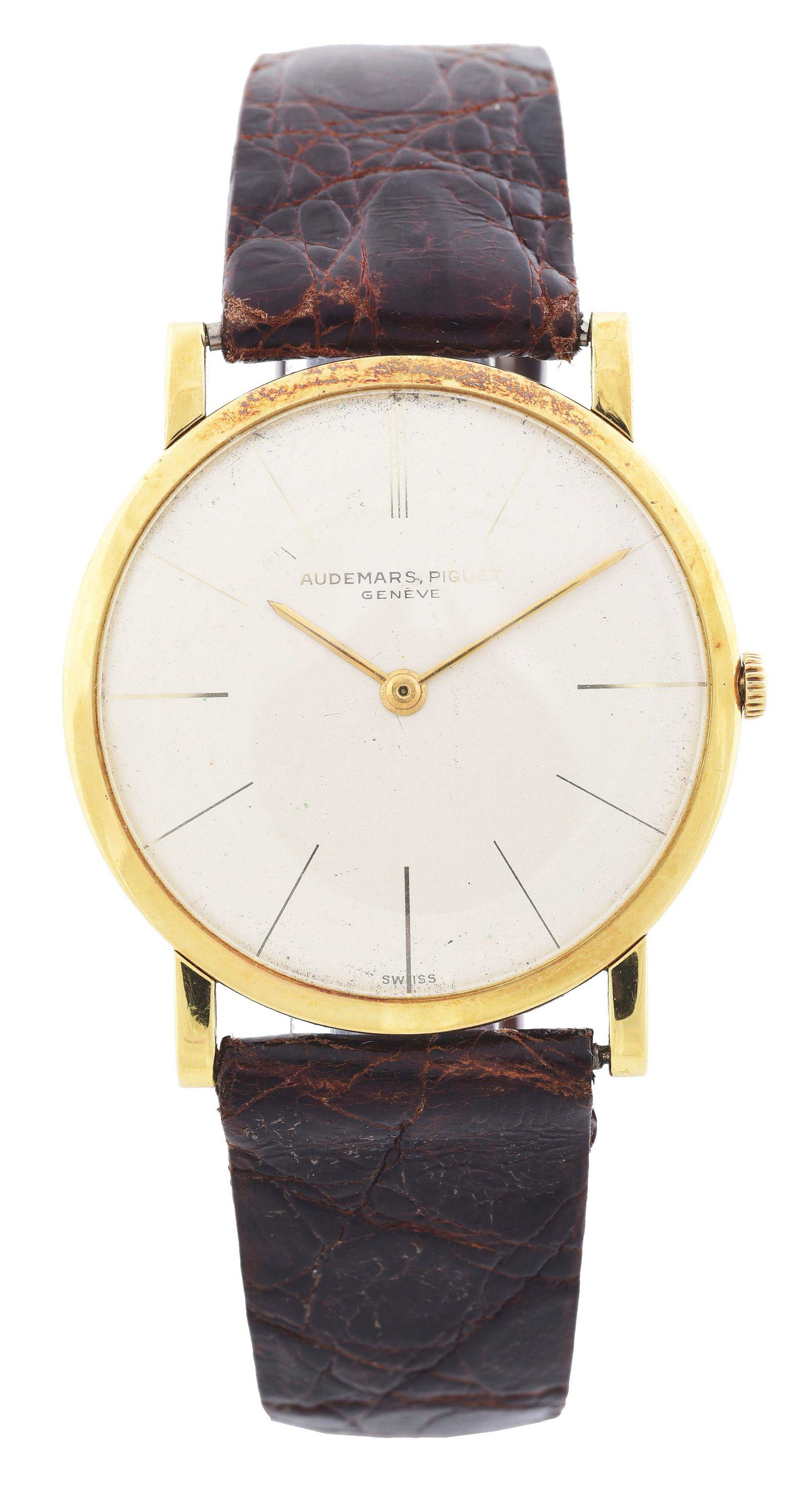 MEN'S 18K GOLD AUDEMARS PIGUET, 31MM SLIM DRESS: Men's Audemars Piguet, Geneve, Switzerland, slim dress wristwatch in 18K yellow gold. Case diameter 31mm, 5mm thick with 18mm lugs. Champagne dial with gold stick hands. Mechanical, manual wind, 17 je