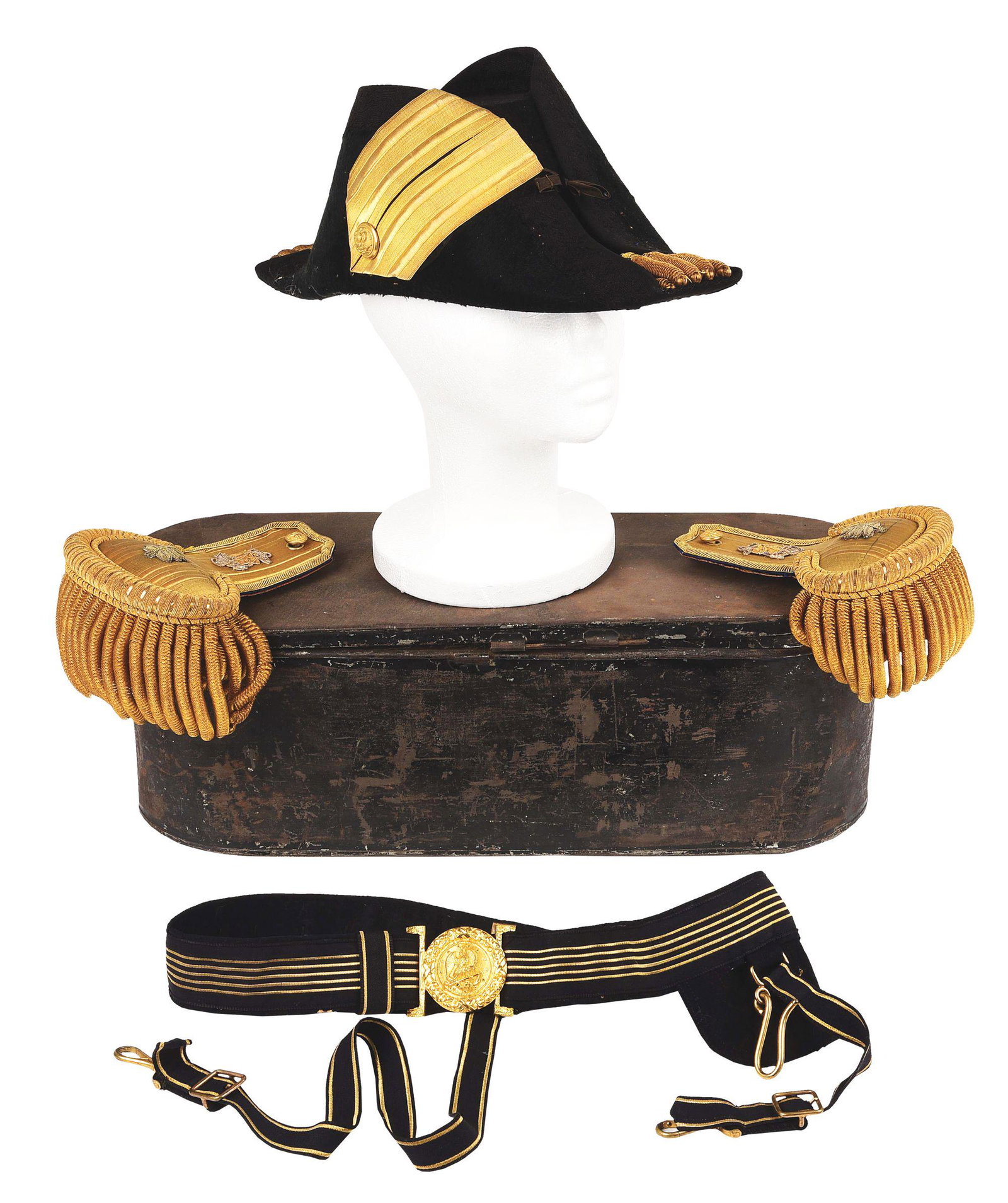 WWI ERA CASED NAVY FOR-AND-AFT HAT WITH COMMANDER: Nice example of a complete WWI era US Navy officer's fore-and-aft hat, epaulets, and belt all contained in the original tin case. The hat is made of beaver felt and displays elegant gold fringe. CONDI
