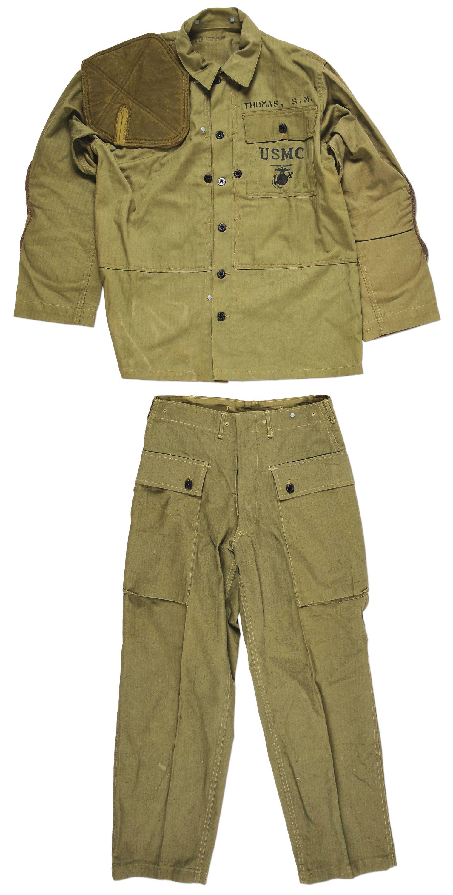 HIGH CONDITION USMC P44 SHOOTING JACKET AND TROUSERS: High condition USMC P44 fatigue jacket with matching P44 fatigue trousers with large 3 button cargo pocket on the back. The jacket is stamped "Thomas, S.M." above the pocket. The jacket exhibits a sta