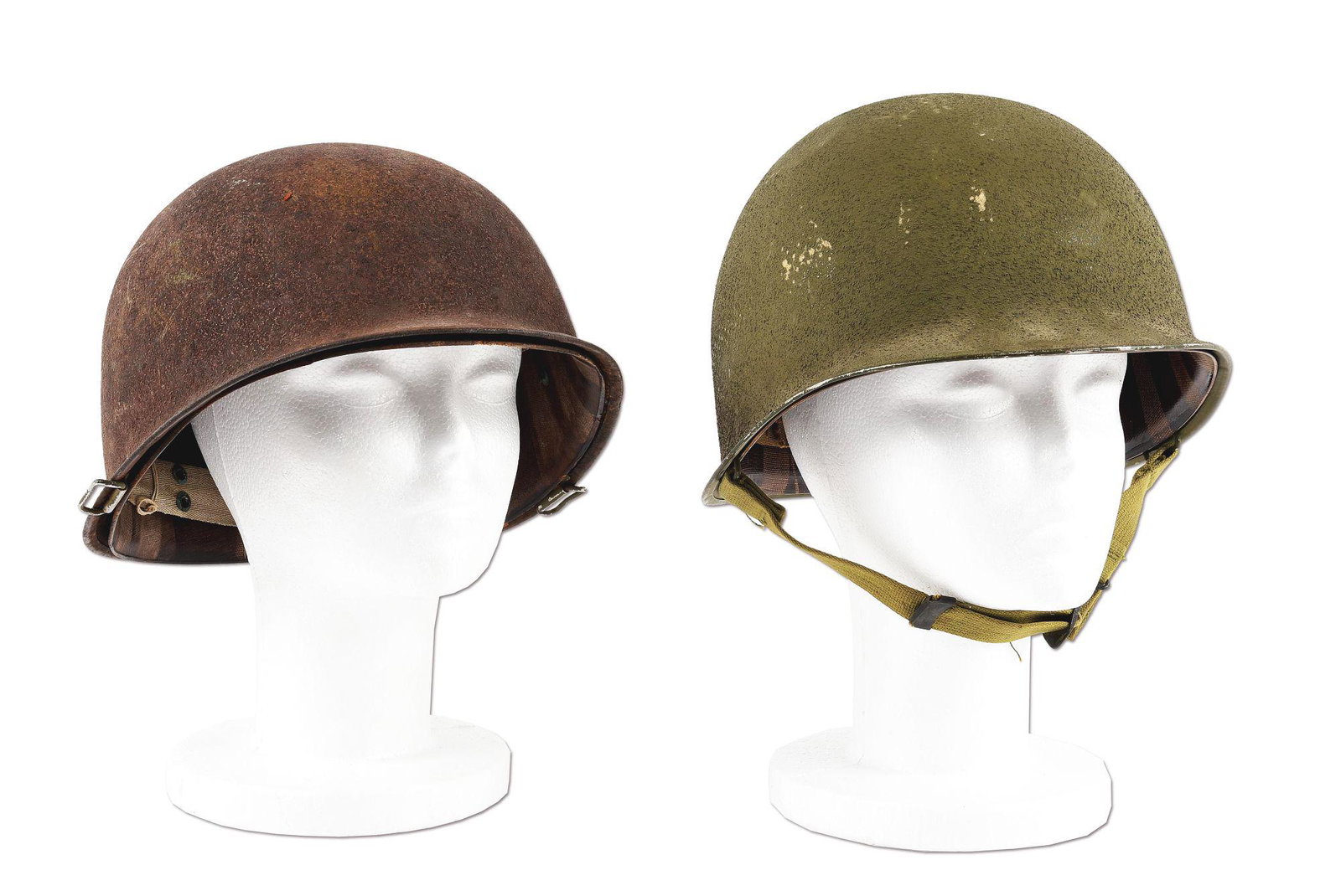 LOT OF 2: US WWII M1 HELMETS: Lot consists of: (A) Excellent example of a US WWII front seam fixed bale helmet with liner. This is an early war McCord contract M1 helmet with a "56D" heat stamp. The liner is marked with the Westin