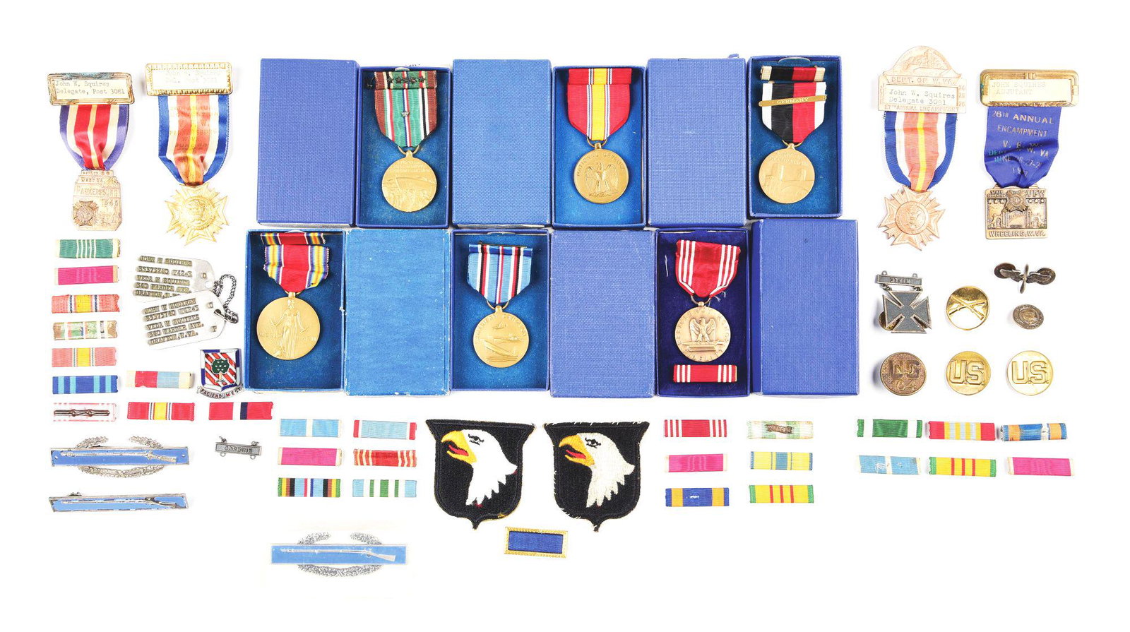 LOT OF 56: US WWII-POST WWII MEDALS, RIBBONS, BADGES: Lot consists of miscellaneous insignia that dates from WWII to the post WWII era. The lot contains a pair of WWII dog tags that are ID'D to West Virginia native John W. Squires. Along with the dog tag