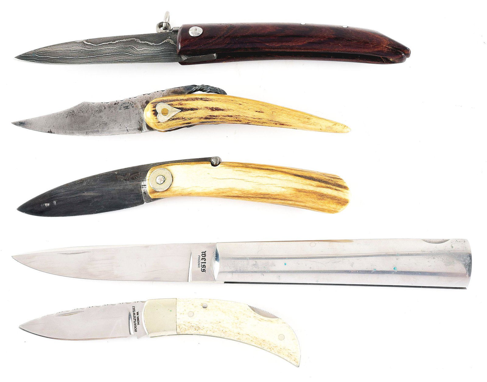 LOT OF 5: CUSTOM MADE SINGLE BLADE FOLDING KNIVES.: (A) Unmarked 4 - 3/4" hard wood handled lock back knife with fancy Damascus drop point blade. c. late 20th century. CONDITION: Mint. (B) SCHWARZER and figure of anvil 4" stag horn handled clip point b