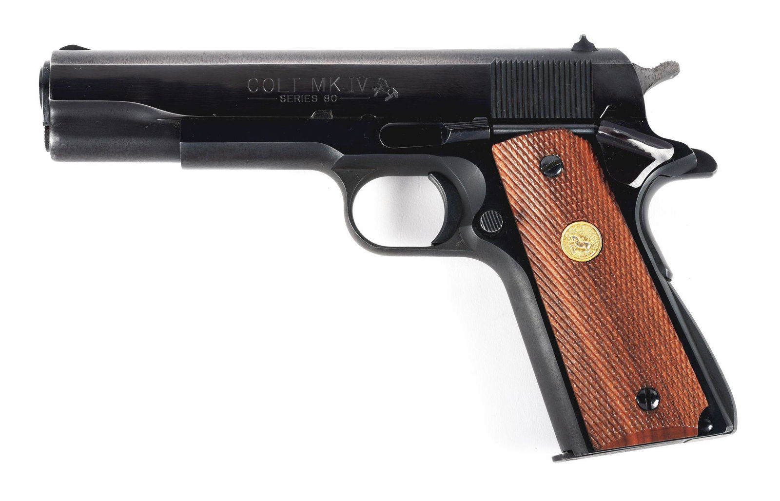 (M) COLT SERIES 80 MK IV GOVERNMENT MODEL: Classic configuration of a series 80 with GI sights, spur hammer, checkered small parts, Colt Gold medallion fully checkered grips, serrated arched mainspring housing. Firing pin safety intact. CONDIT