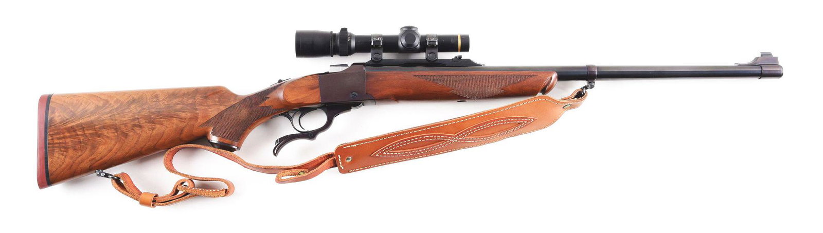 (M) RUGER NO. 1 SINGLE SHOT RIFLE IN .375 H&H WITH: Sturm Ruger Model "No. 1 Tropical" single shot rifle made in 1993. Blued heavy tapered barrel with banded blade front sight and rear express sight rail with Ruger rings. Blued falling block action wit