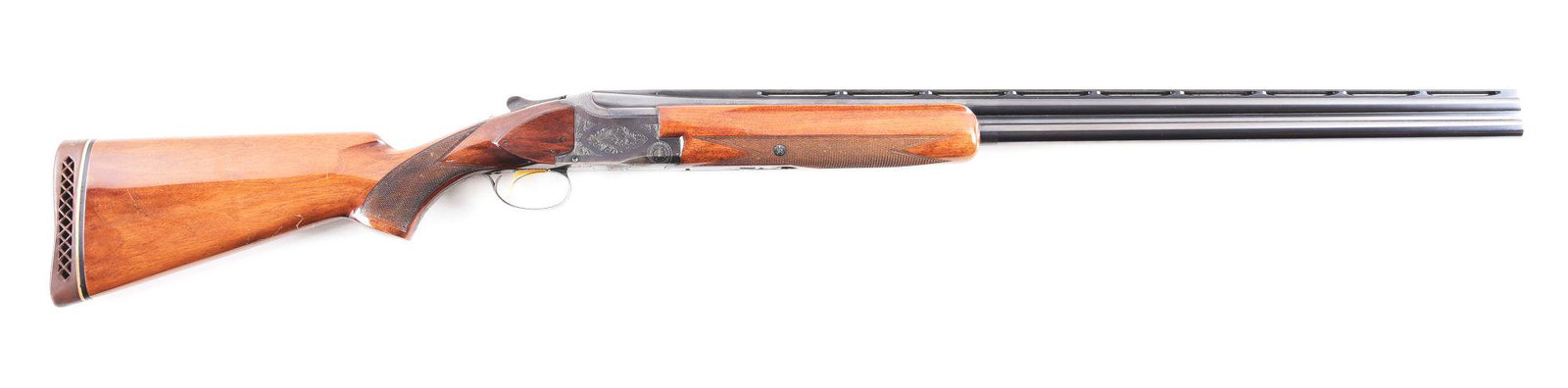(C) BROWNING SUPERPOSED OVER-UNDER SHOTGUN.: Browning Grade I Superposed Lightning "Broadway Trap" over-under shotgun made in Belgium in 1962. Blued steel barrels with wide flat ventilated rib, fixed chokes, ejectors, and twin bead sights. Blued
