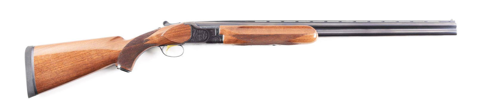 (M) CHARLES DALY OVER-UNDER SHOTGUN.: Charles Daly "Superior Grade" over-under shotgun made in Japan circa 1980. Blued ventilated rib barrel with twin bead sights and fixed chokes. Blued floral engraved receiver with gold washed single se