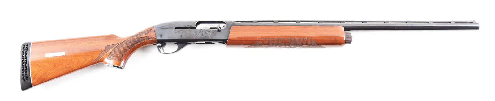 (M) REMINGTON 1100 SEMI-AUTOMATIC SHOTGUN.: Remington Model 1100 semi-automatic shotgun made in 1971. Blue ventilated rib barrel with twin bead sights and "Skeet" choke. Blued scroll engraved receiver. Walnut checkered pistol grip stock with Re