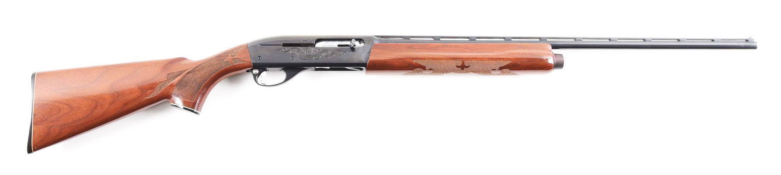 (M) REMINGTON 1100LW SEMI-AUTOMATIC SHOTGUN.: Remington Model 1100LW semi-automatic shotgun made in 1982. Blued ventilated rib barrel with twin bead sights and Skeet choke. Blued receiver with rolled floral engraving pattern with aluminum trigger