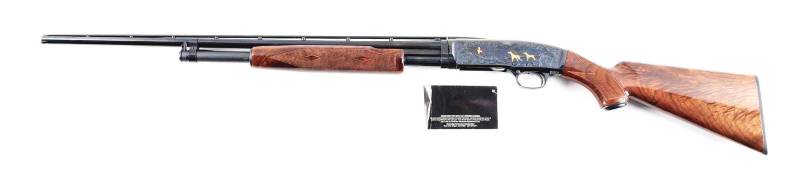 (M) GOLD INLAID & ENGRAVED BROWNING MODEL 42 HIGH GRADE: Gold Inlaid and Engraved Browning Model 42 High Grade slide action shotgun. Made 1991 in Japan. 26" round steel barrel with full rib and bead front sight. High polish blued finish with scroll engravin