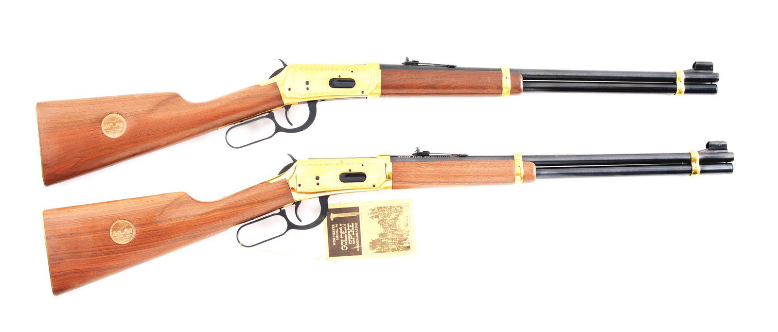 (C) LOT OF 2: WINCHESTER MODEL 94 GOLDEN SPIKE: Lot consists of (A) Winchester Model 94 Golden Spike Commemorative lever action carbine. Made 1969. "GOLDEN SPIKE COMMEMORATIVE" on the right side of the barrel. Round steel barrel with hooded blade f