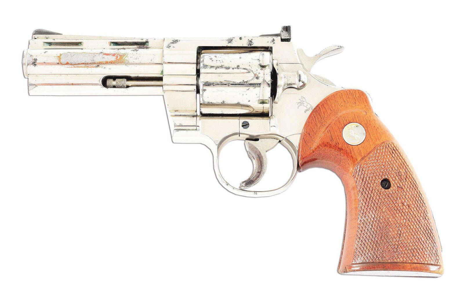 (M) COLT PYTHON DOUBLE ACTION REVOLVER.: 1970 vintage Colt Python, serial number E18831. Nickel with 4" barrel. Chambered in .357 Magnum. Correct checkered walnut grips with silver Colt medallions. Aftermarket serrated adapter mounted to tri