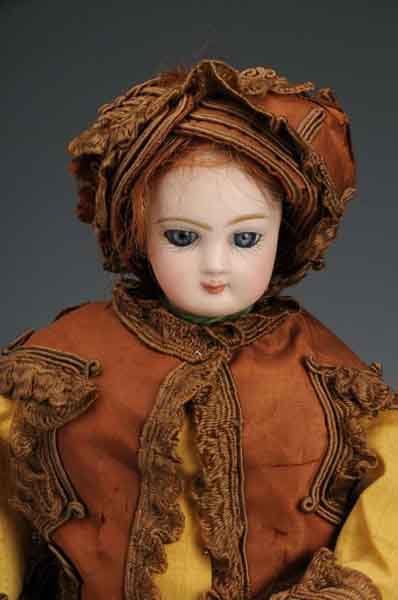 Jumeau French Fashion Doll.: Description Bisque swivel head on separate shoulder plate with blue stationary eyes and closed mouth mounted on all leather, gusseted fashion body. Showing some wear and soiling, particularly on hands